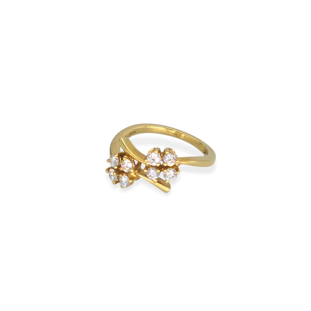 Anello a fiore in oro 18kt e zirconi bianchi
