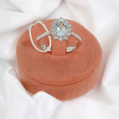 Anello donna in oro 9kt con pietra azzurra centrale e zirconi bianchi Igold