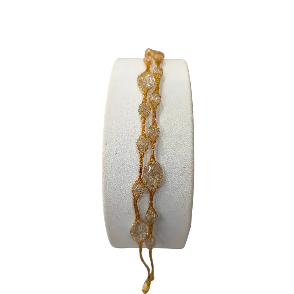 Bracciale donna in oro giallo 18kt effetto seta e pietre
