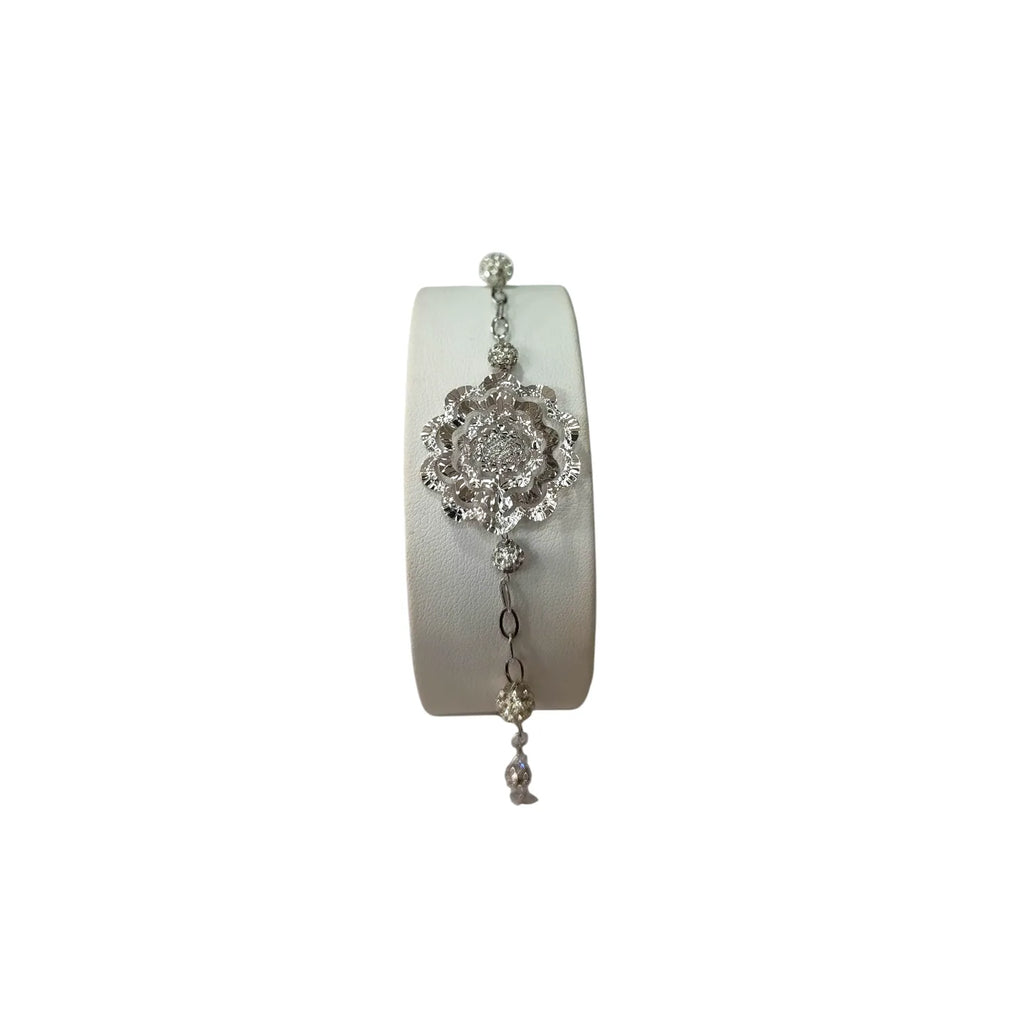 Bracciale donna lavorato in oro bianco con fiore centrale