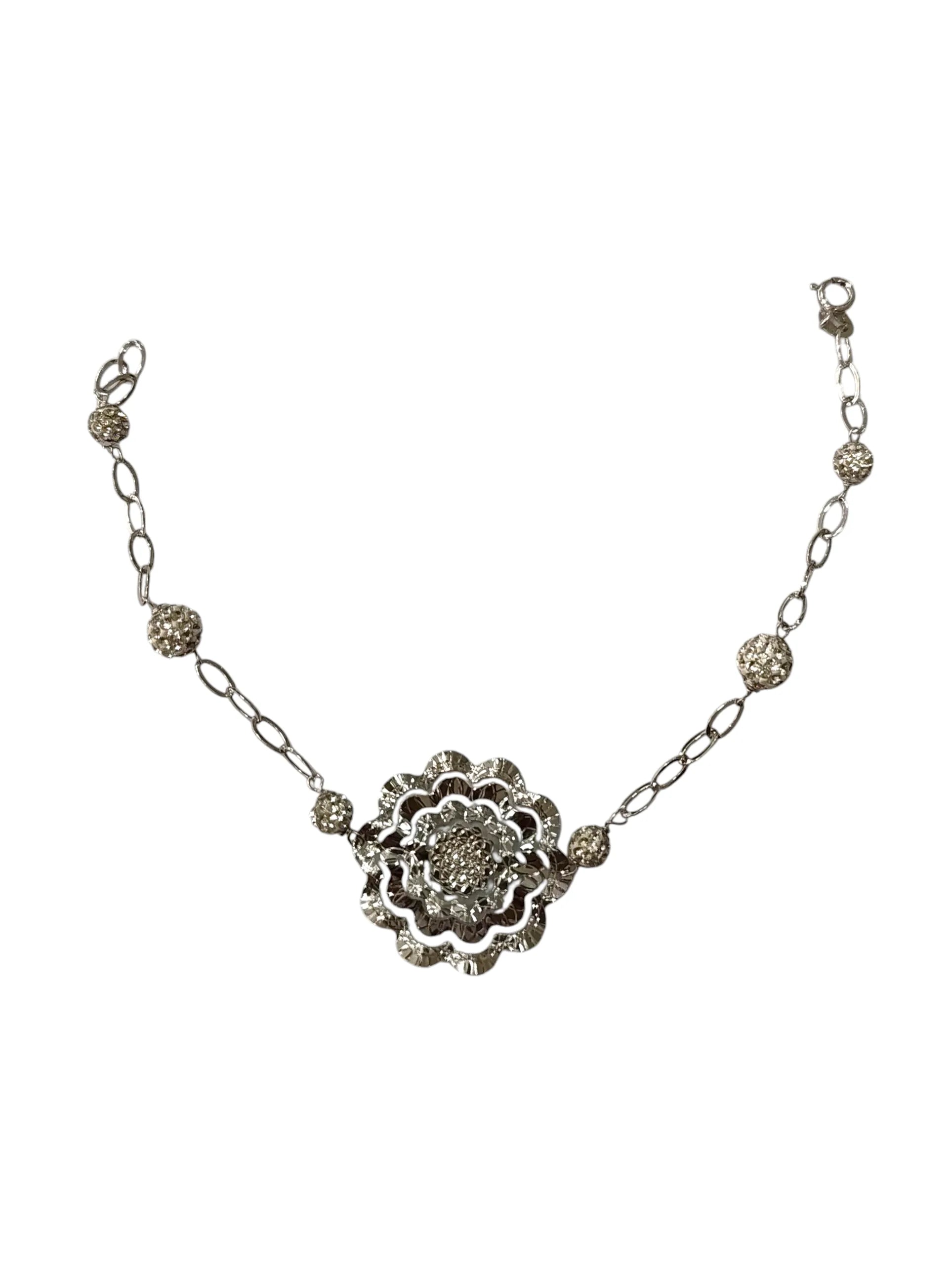 Bracciale donna lavorato in oro bianco con fiore centrale