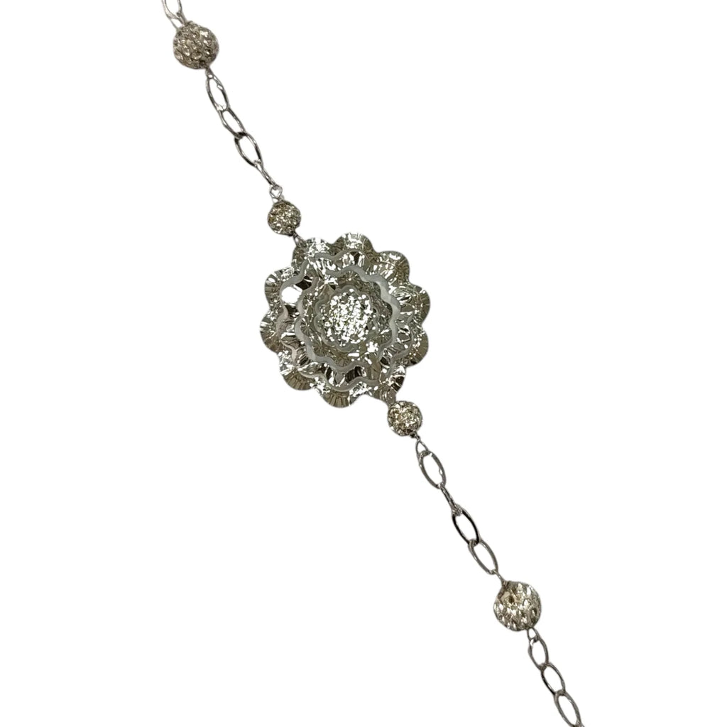 Bracciale donna lavorato in oro bianco con fiore centrale