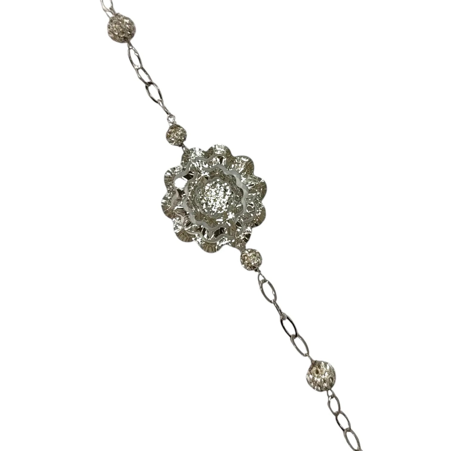 Bracciale donna lavorato in oro bianco con fiore centrale
