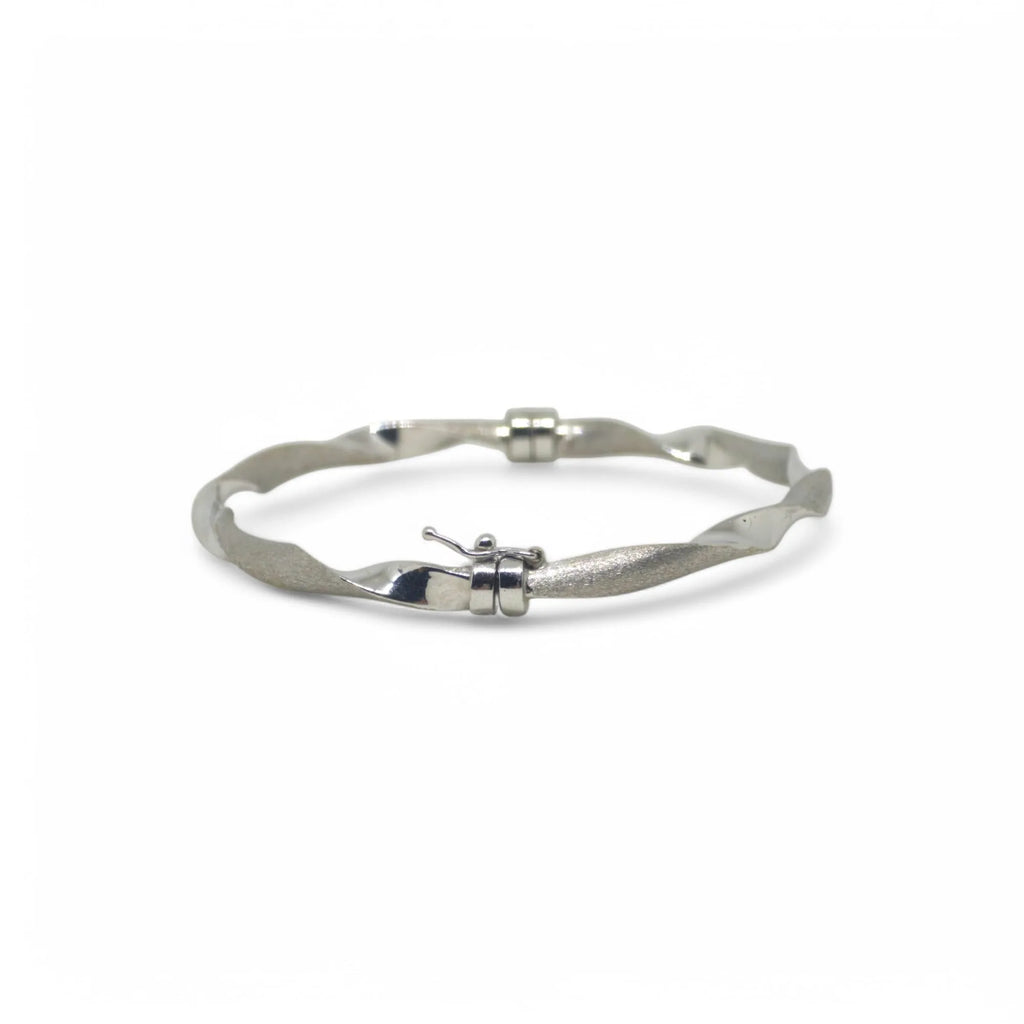 Bracciale donna rigido ondulato elegante in oro bianco 750