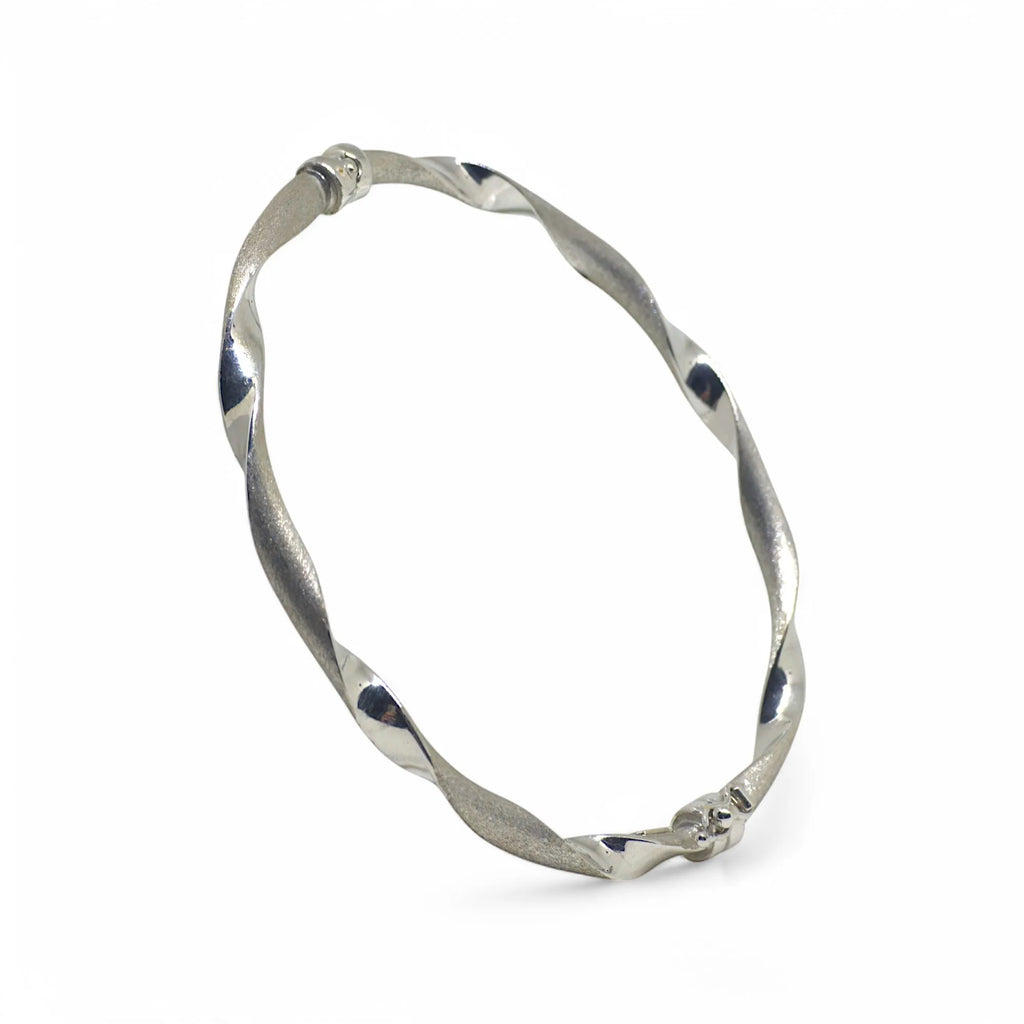 Bracciale donna rigido ondulato elegante in oro bianco 750