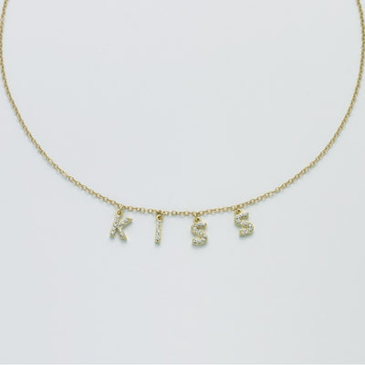 Collana donna Kiara charms scritta kiss in ottone dorato KCLD3883G