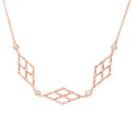 Collana in ottone rosato con tre rombi e brillanti