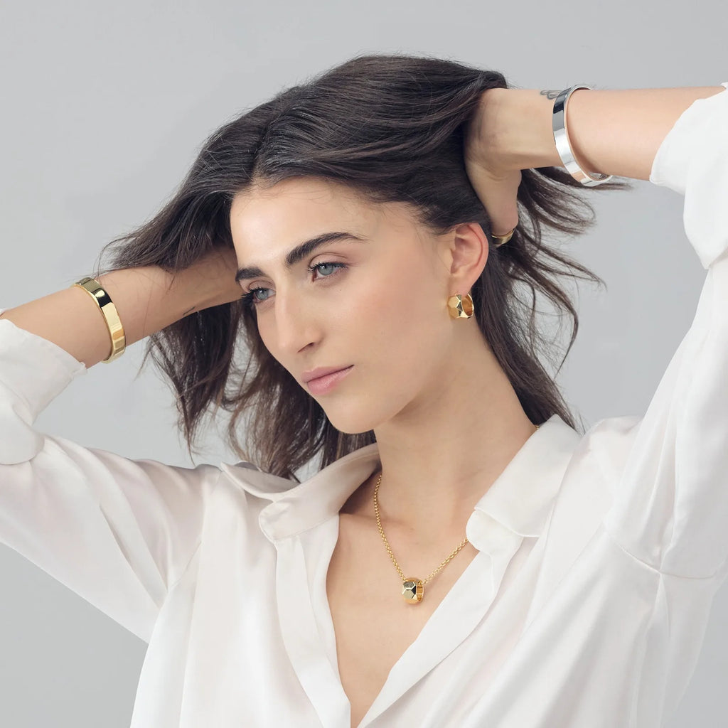 Orecchini a cerchietto donna Unoaerre in bronzo dorato 2596