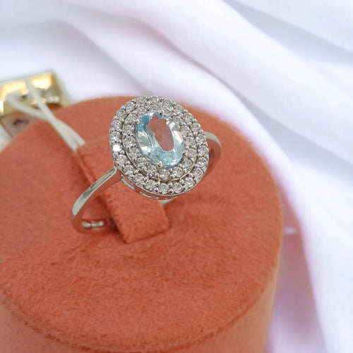 Anello donna in oro bianco 9kt con pietra azzurra centrale e zirconi Igold