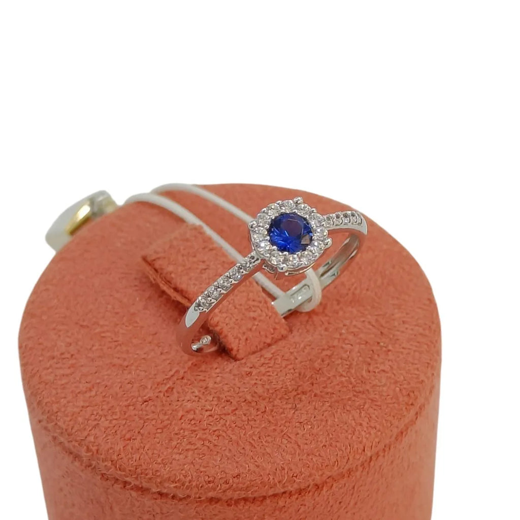 Anello donna in oro bianco 9 carati con pietra blu centrale e zirconi Igold
